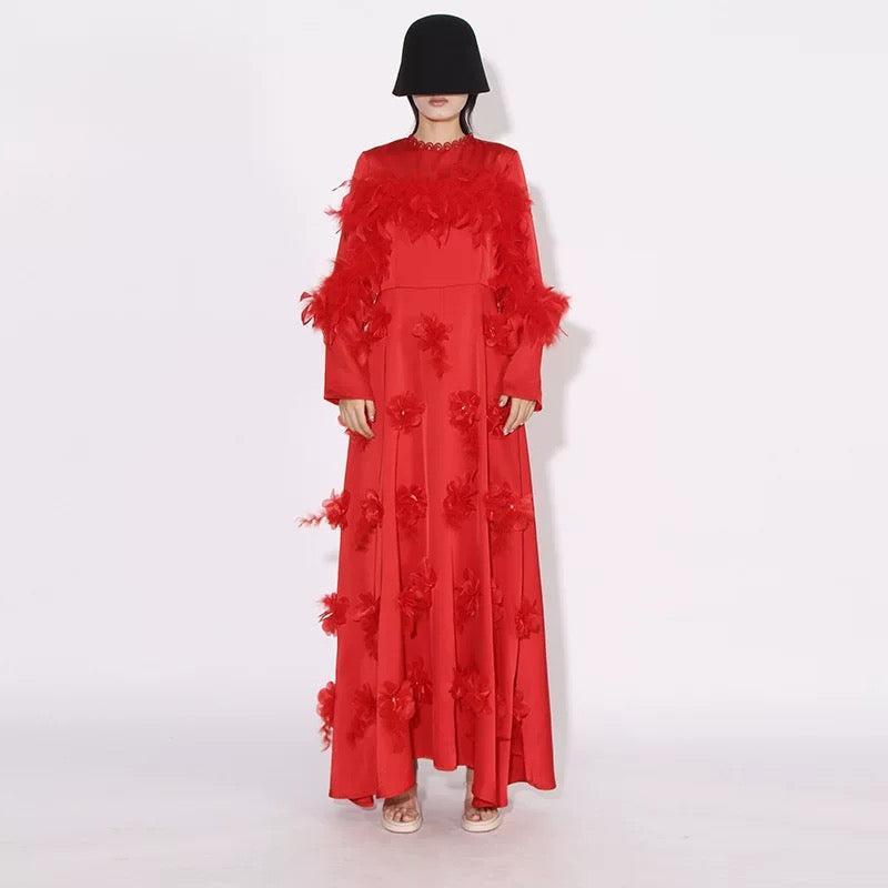 Elegant long feathered dress with floral embellishments, perfect for a sophisticated autumn 2024 look.